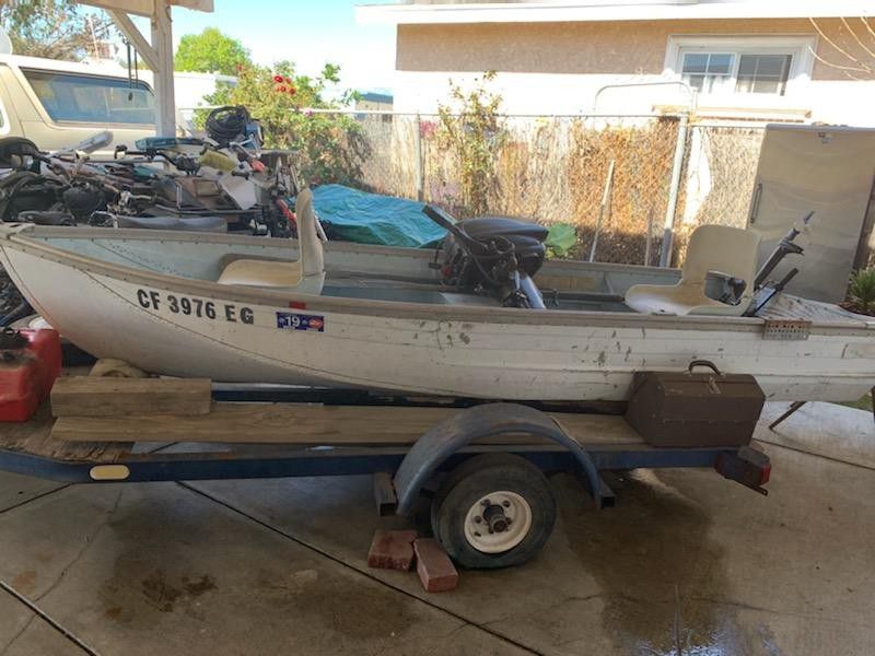 Fishing boat with trailer, 2020 tags, and motor