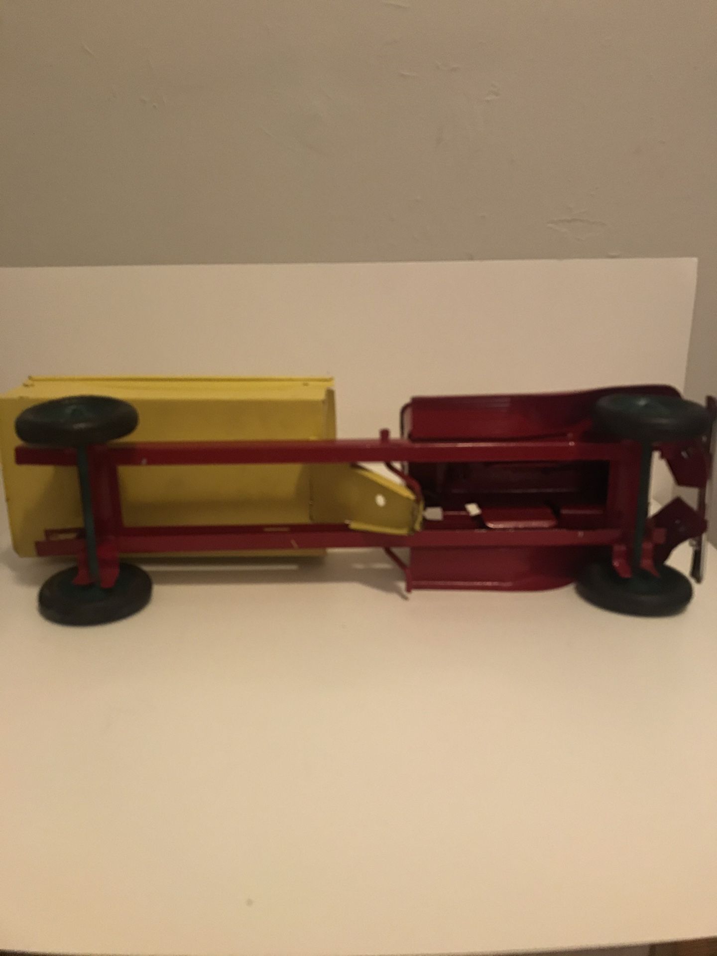 Vintage and Rare Turner Toys Pressed Metal Red and Yellow Dump Truck with Battery Slot for Working Headlights 18in Length 6in Height Normal Wear Rubb