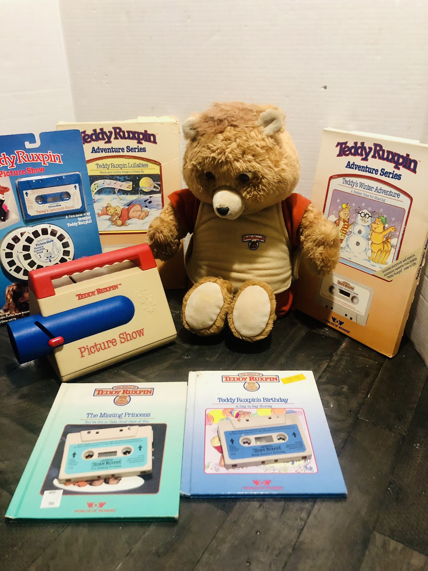 Vintage Large Teddy Ruxpin Bear and Tape Bundle  Teddy Reads BUT the eye and mouth mechanism is not working Easy Fix for a handy man.  New Tapes and B