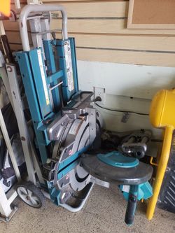 Makita 12-inch Dual-Bevel Sliding Compound Miter Charger And Battery. Saw With Rolling Stand.