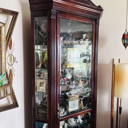 Heavy solid wood corner curio cabinet with seven shelves and light  86.5”h x 44”w x 23”d