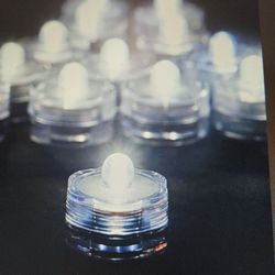 Warm White Waterproof Flameless Candle Tea Lights, Battery Operated - 12 Pieces