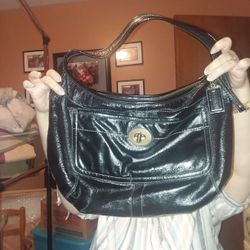 Black Leather Coach shoulder bag with turn key lock