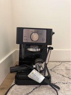 DeLonghi espresso maker with milk steamer