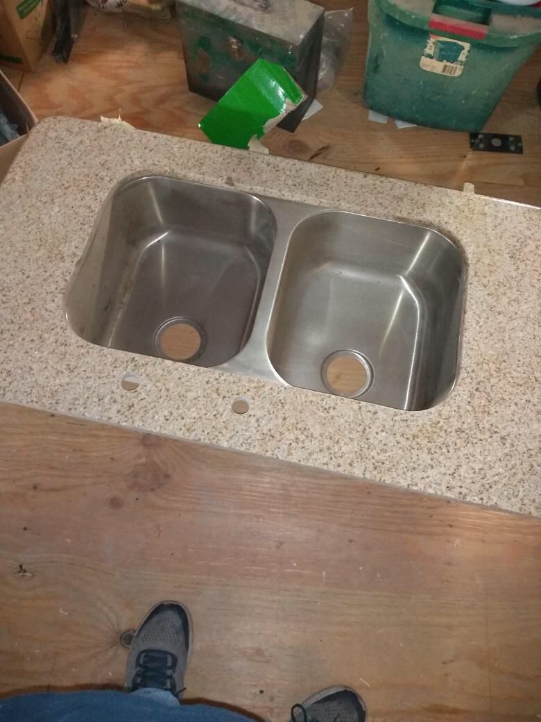 Granite top and double bowl sink. New, never used. Perfect for a dock or outdoor kitchen.