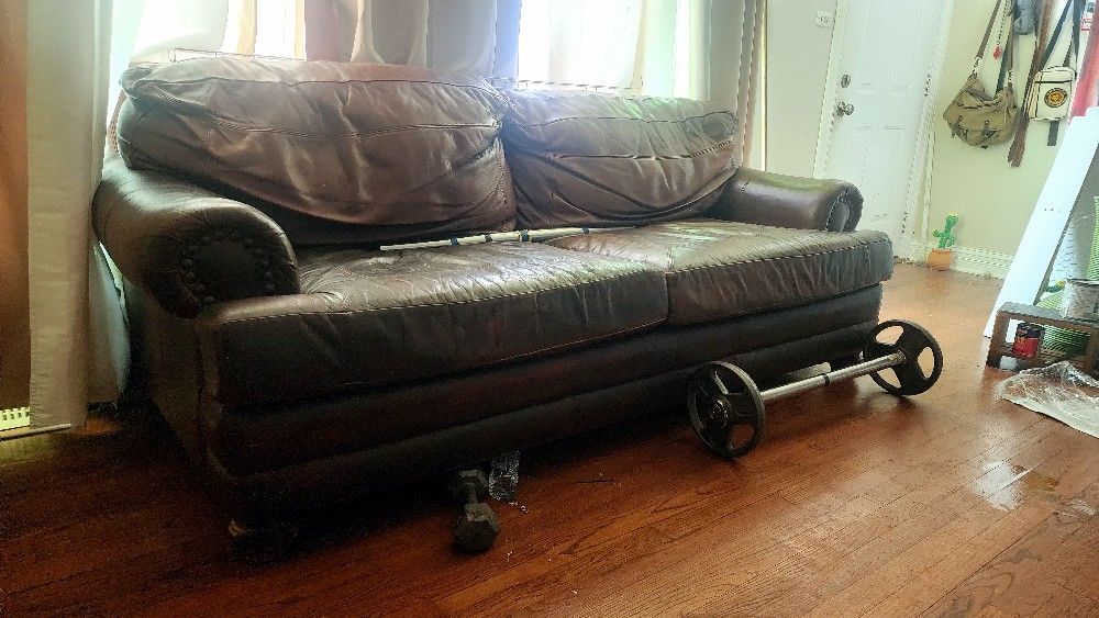 Brown genuine leather sofa with footrest