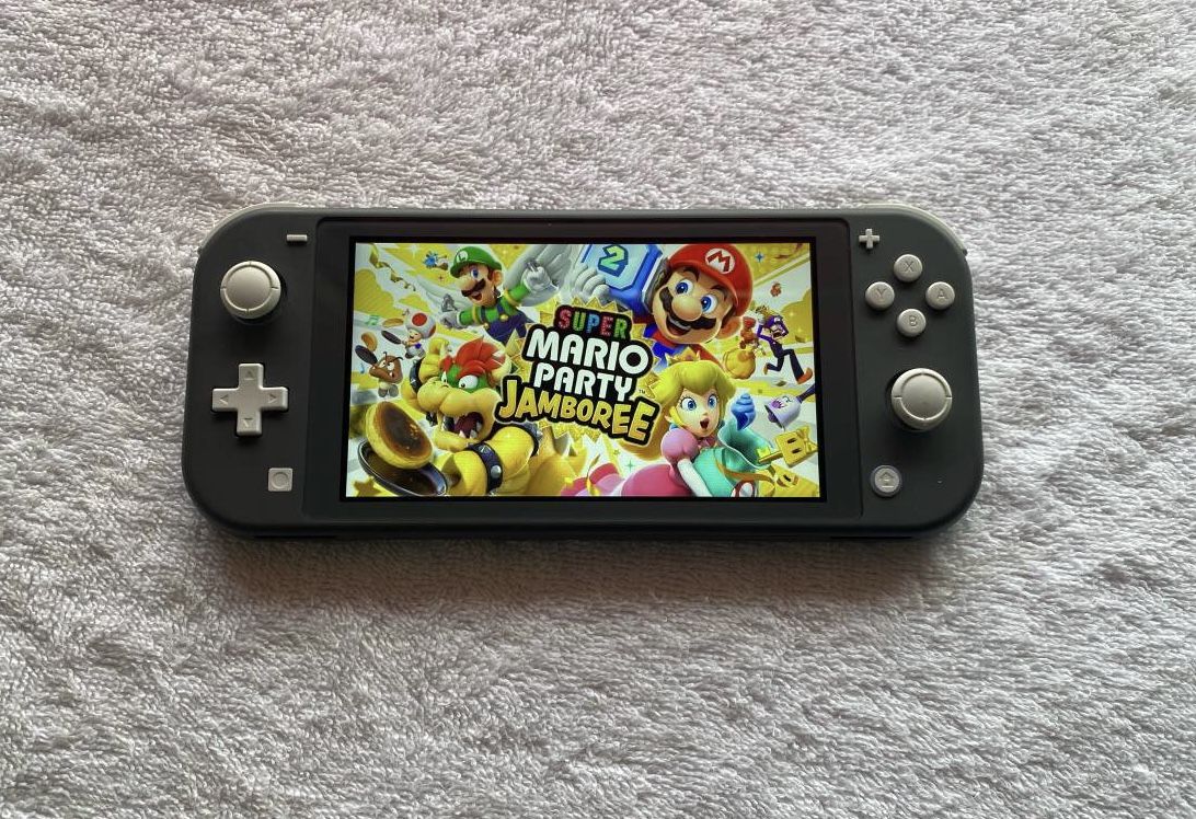 NINTENDO SWITCH LITE with 55 SWITCH GAMES