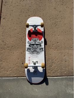 Samurai style deck with thunder trucks and spitfire wheels