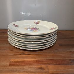 These plates are vintage Hispania porcelain from Manises, Spain, hand-painted with floral motifs.