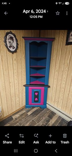 Custom painted corner shelf.