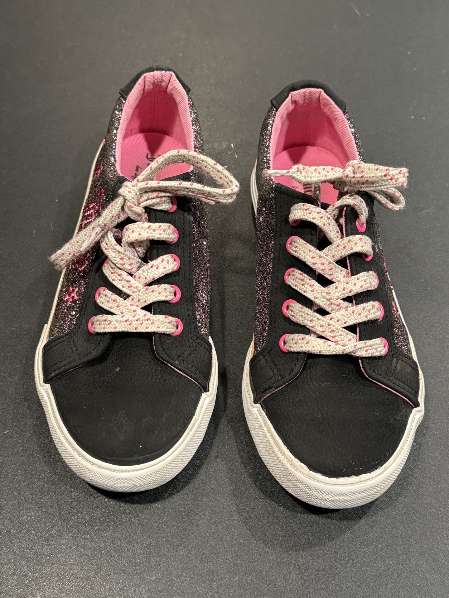 Girls Size 2 Juicy Couture Tennis Shoes Black With Pink Detailing/Sparkles. Good condition with the exception of missing the crown logo on the heel of