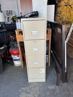 Tan metal tall 4-drawer standard / letter size file cabinet. Good condition. Measurement: Tall four drawer fall cabinet