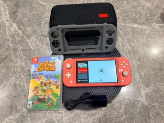 Nintendo switch lit pink with one game