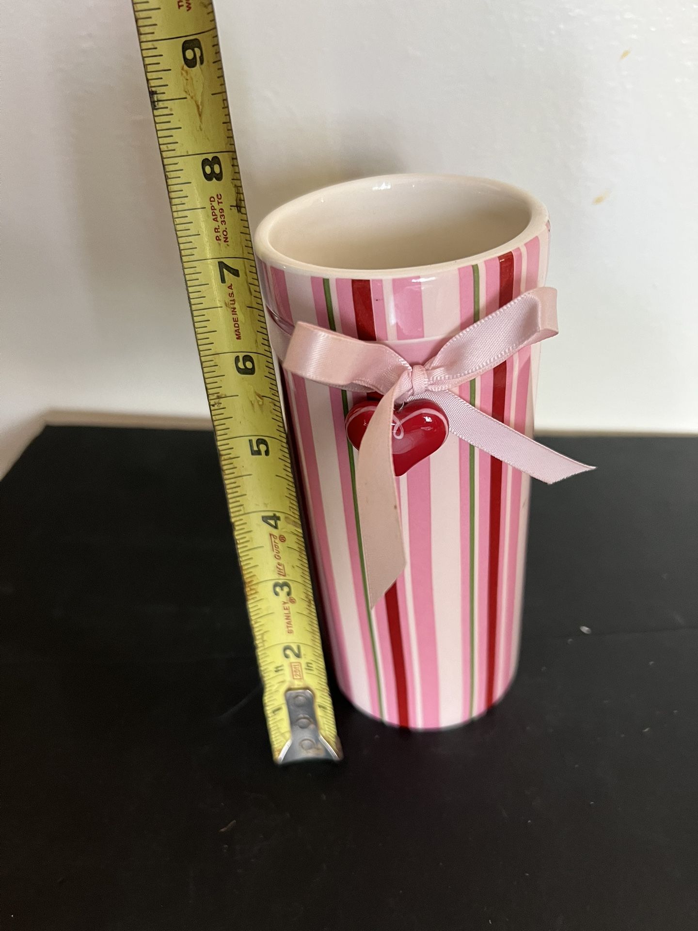 Cylindrical striped vase with a pink ribbon and a heart-shaped charm , Valentines/ Mothers Day Floral Item
