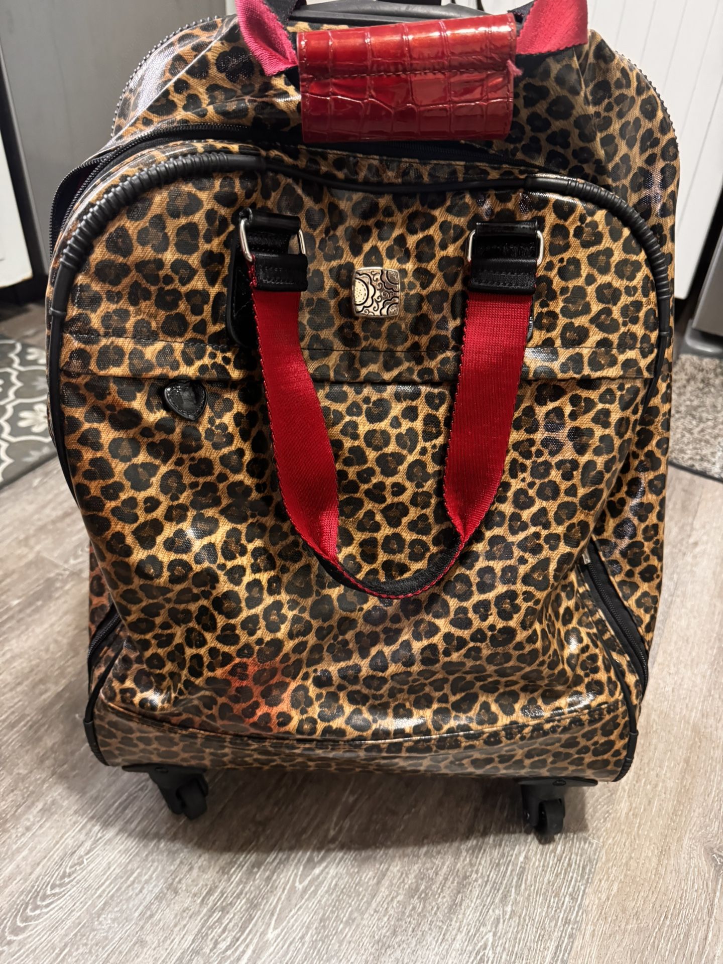  Brighton Catwalk Weekender rolling carry-on Luggage bag with a leopard print. 