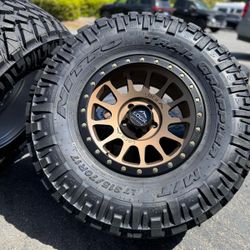 17x9 bronze Yosemite Jeep Wrangler Gladiator wheels Nitto MT 35” tires 5x127 315/70r17