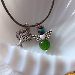 Green Angel With A Family Tree