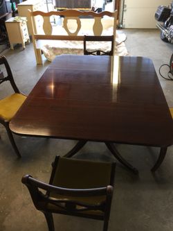 Mahogany table and chairs table has the Watertown slide. Table is 42” wide. Length varies 23”,35”,54” or 66”.