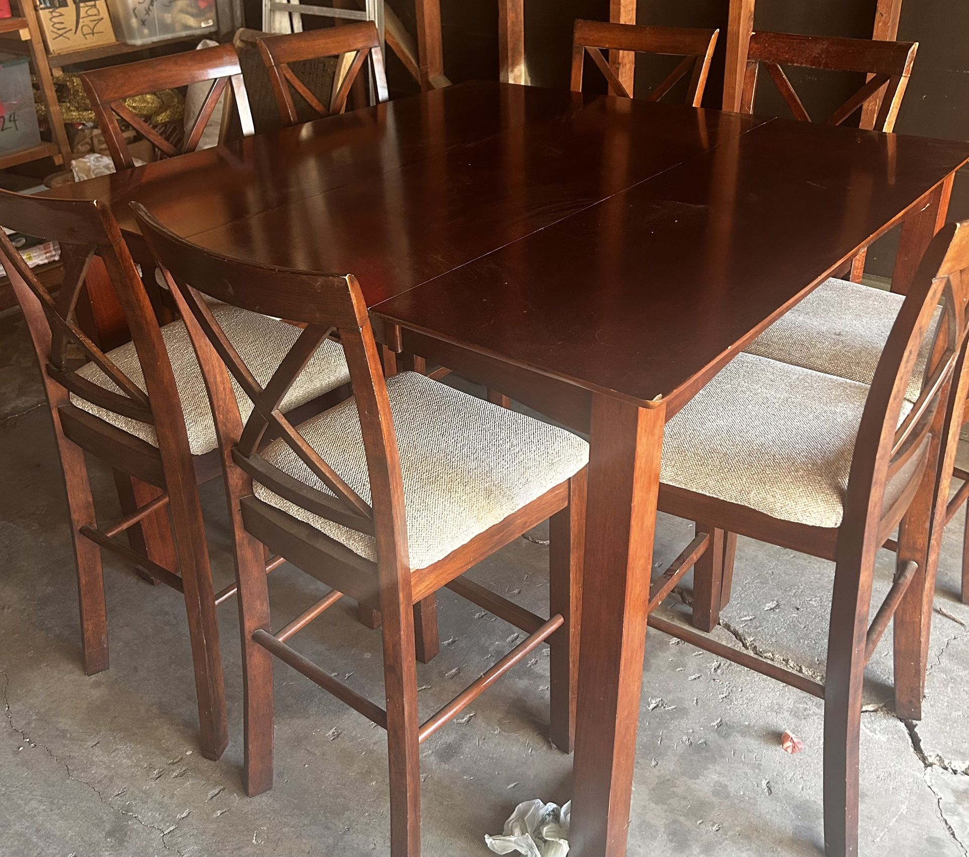 Pub style dining room table with eight chairs