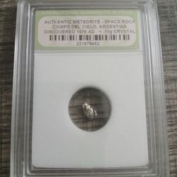 authentic meteorite, specifically a space rock from Campo del Cielo, Argentina.
Type: Authentic Meteorite - Space Rock.
Origin.  Vintage 