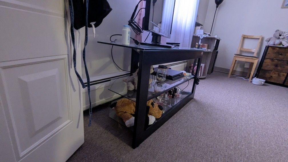 A Guitar ๐ธ And Glass TV Stand And A Bike