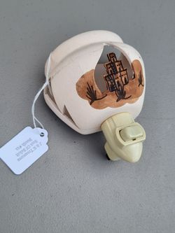Southwestern vintage ceramic plug-in night light featuring a cut-out design.
Design depicts a stylized Southwestern landscape.