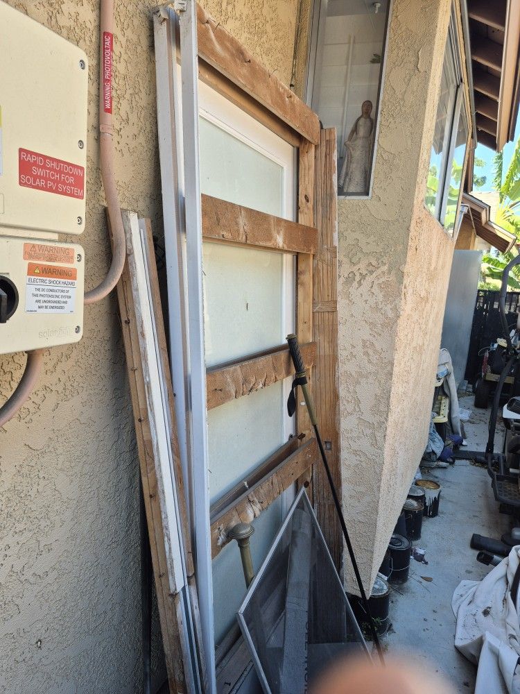 Frosted glass pocket door with assembly.