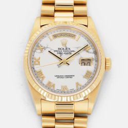 ROLEX YELLOW GOLD DAY-DATE REF. 18238 WITH HOWLITE DIAL