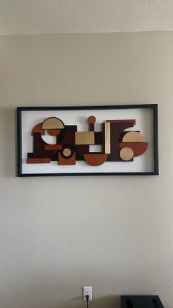 Two wood wall art pieces