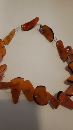 Delicate orange necklace.