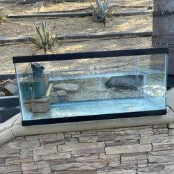 40 g. Fish tank with pump, heater, lamp, and lid. 