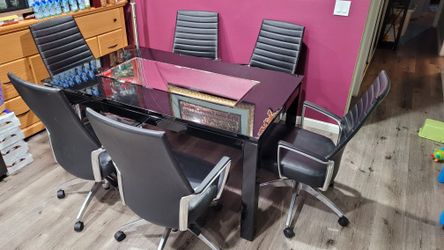 Dinner Table With A Set Of 6 Leather Adjustable Chairs $699