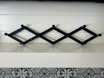 Black metal wall rack $12