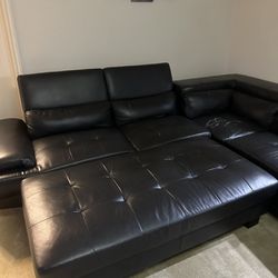 Black sectional with ottoman
