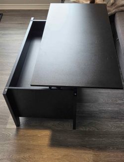 Black lift top coffee table with hidden storage and bottom shelves