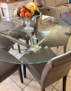 Modern glass dining table with chrome base