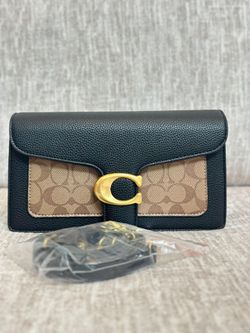 Coach Tabby featuring pebbled black leather paired with signature canvas . Brand New.