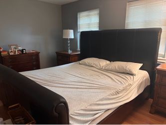 King leather bed frame and Antique glass dishes