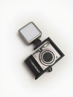 Camera cage for compact digital cameras.