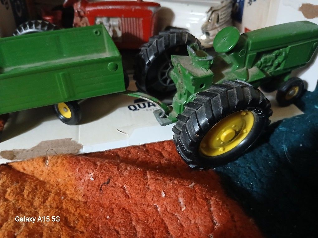 add or separated ERTL (John deere) tractor and hay hauler