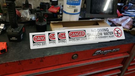 Pool no diving sign shallow water