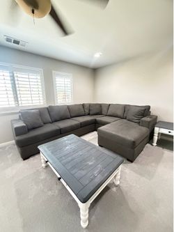 Dark gray couch with reservable chaise