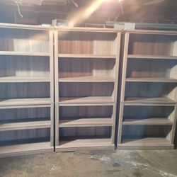 SET OF 3 BOOKCASES WITH 4 SHELVES EACH IN DECENT CONDITION. GREAT FOR HOME OFFICE OR ANY BUSINESS.  MEASUREMENTS ARE 70X12X35.$100.00 OR BEST OFFER. 