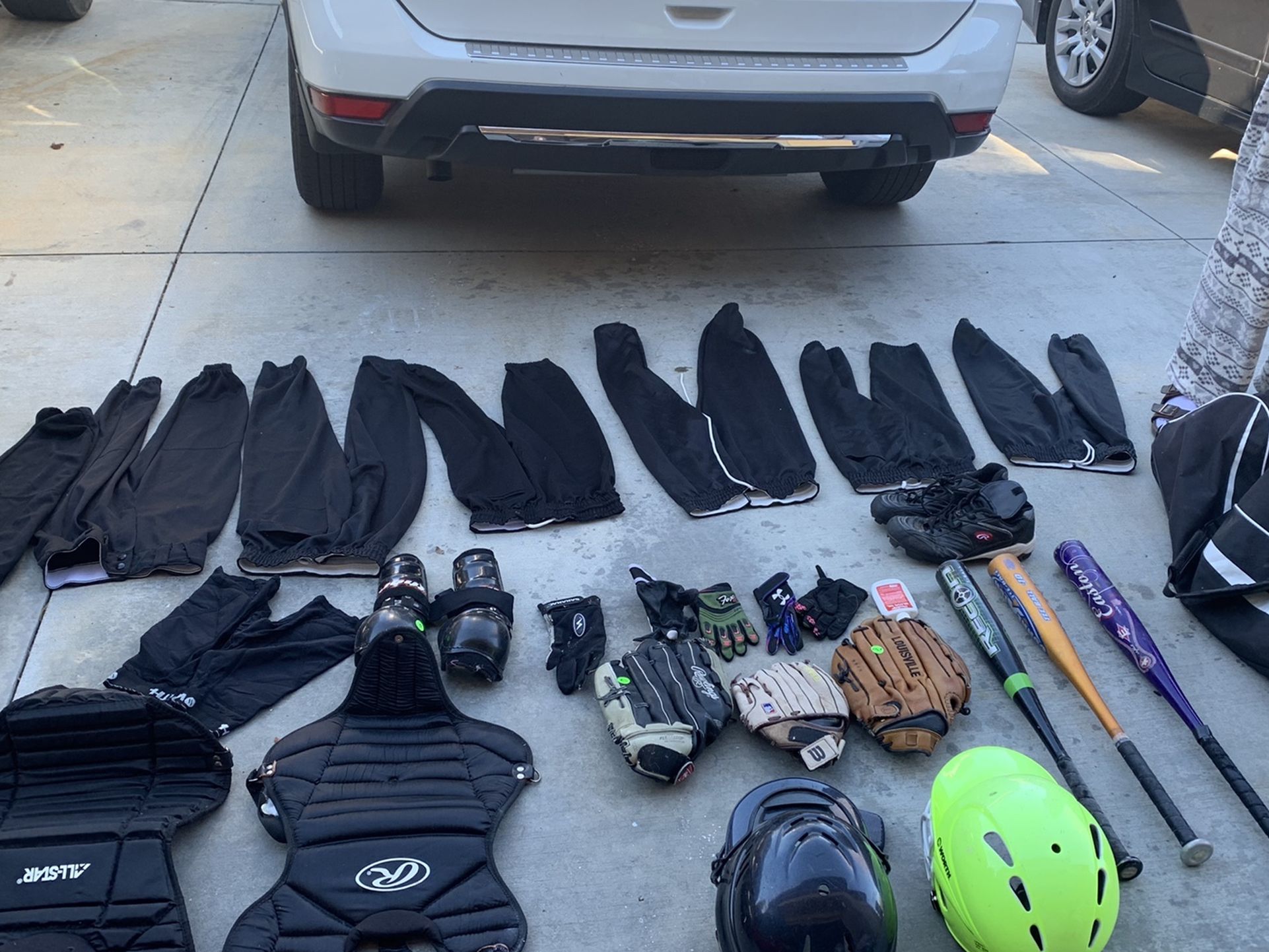 Softball Bag With Lots Of Gear And Equipment