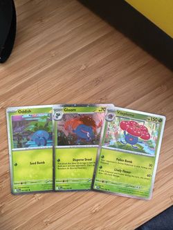Pokémon Holo Oddish, Gloom, and Vileplume from Phantasmal Flames