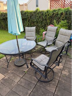 Hampton Bay glass table patio set- with 4 chairs