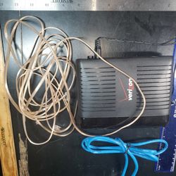 Actiontec GT784WNV device+ Cat 5e Ethernet cable+  coiled Category 3 (Cat 3) cable, a telephone cable or station wire
likely a DSL modem or gateway, s