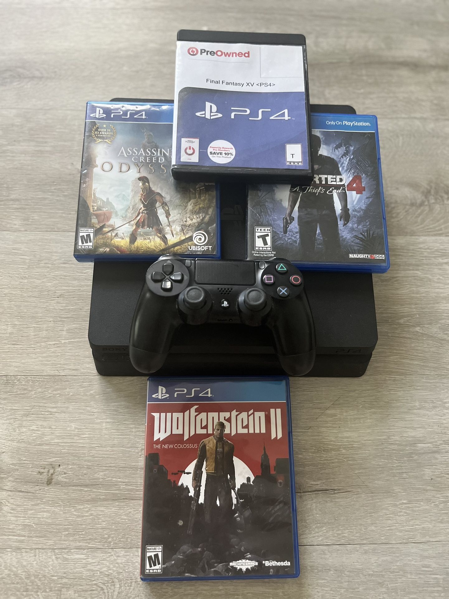 PS4 with 4 Games & Controller.