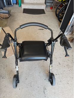 Walker with 4 wheels.