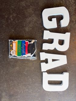 GRAD letters and a set of grad napkins